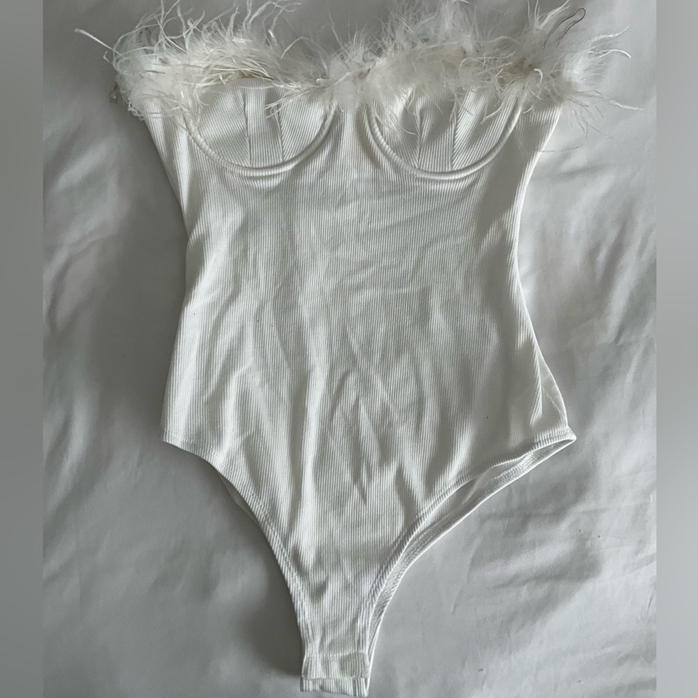 Strapless white bodysuit with feather detail!